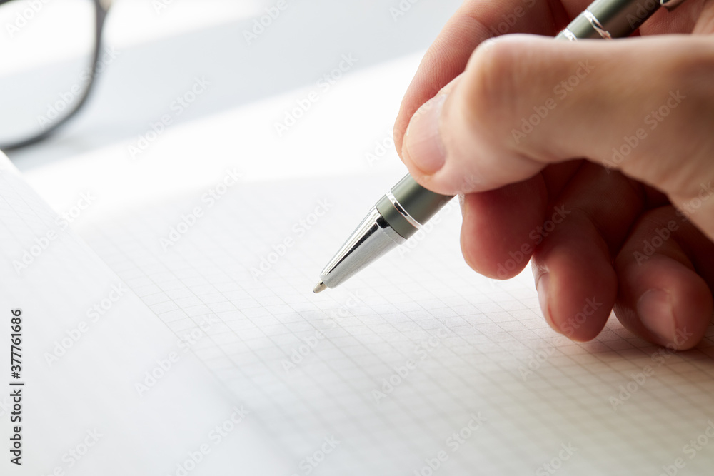 writing activity at blank diary or notebook close up macro. sunlight. paperwork and learning concept. minimal writing activity at blank diary or notebook close up macro. sunlight. paperwork and learning concept. minimal
