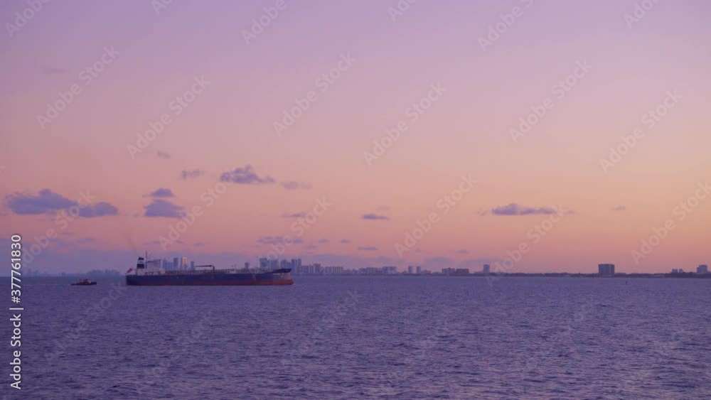 Cargo ship sails along the city coastline in Florida Cargo ship sails along the city coastline in Florida