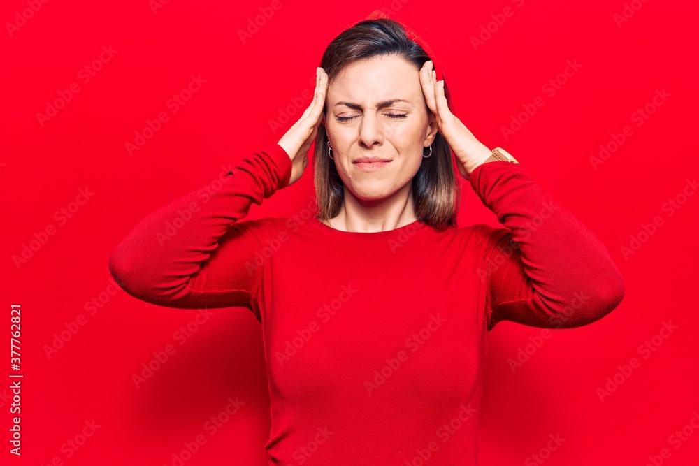 Young beautiful woman wearing casual clothes with hand on head, headache because stress. suffering migraine. Young beautiful woman wearing casual clothes with hand on head, headache because stress. suffering migraine.