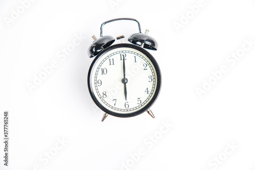 alarm clock isolated on white 6:00