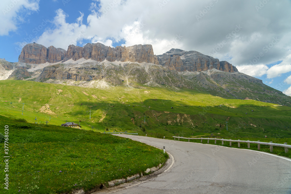 Obraz premium Mountain landscape along the road to Pordoi pass, Dolomites