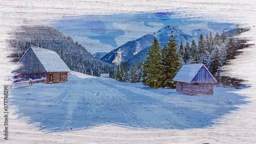 Snowy wooden cottages in wi...