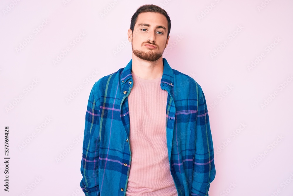 Young handsome man wearing casual clothes looking sleepy and tired, exhausted for fatigue and hangover, lazy eyes in the morning. Young handsome man wearing casual clothes looking sleepy and tired, exhausted for fatigue and hangover, lazy eyes in the morning.