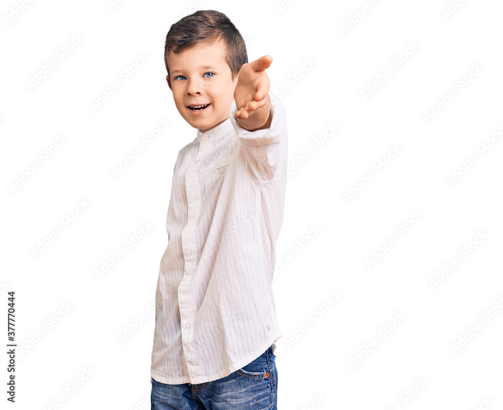 Cute blond kid wearing elegant shirt smiling cheerful offering palm hand giving assistance and acceptance.