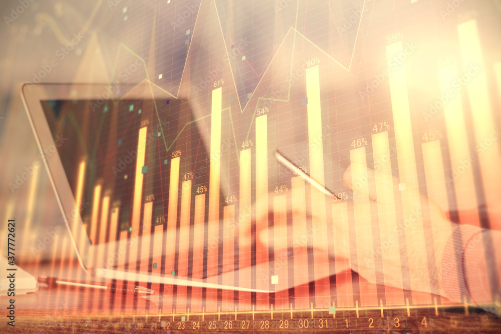 Double exposure of man's hands holding and using a digital device and forex graph drawing. Financial market concept. Double exposure of man's hands holding and using a digital device and forex graph drawing. Financial market concept.