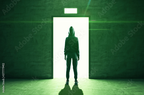 Hacker stands in front of an open elevator door © Who is Danny