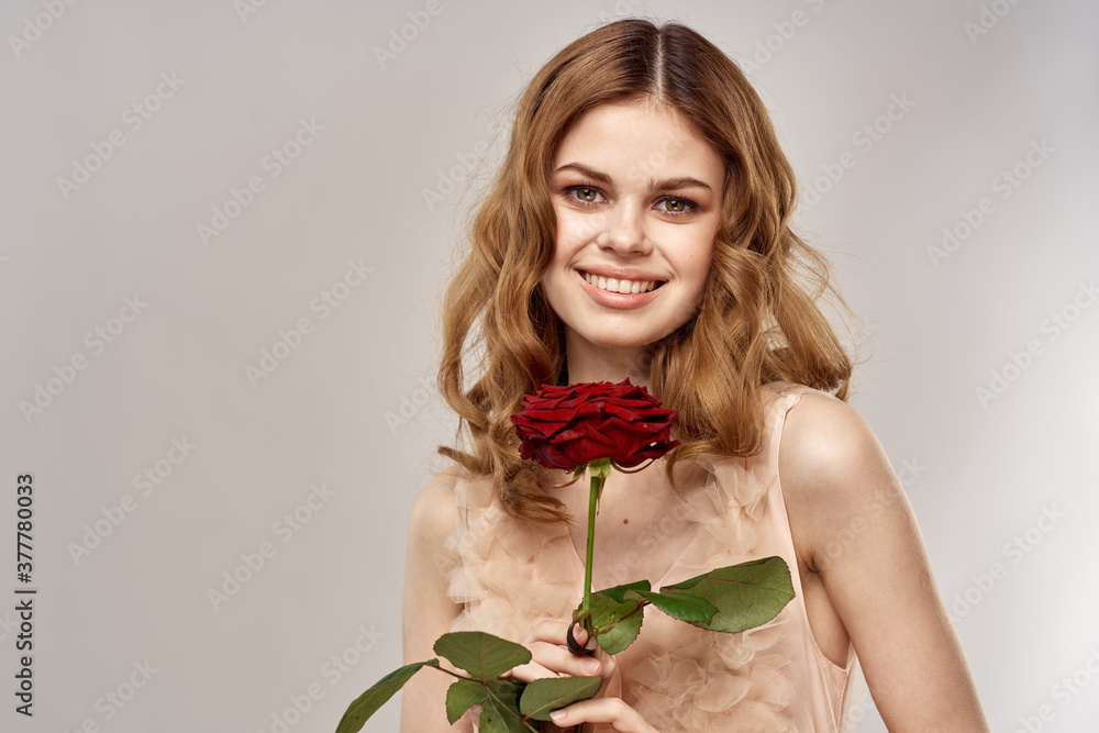 pretty woman with red flower on beige background portrait holidays pretty woman with red flower on beige background portrait holidays