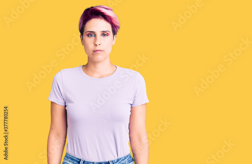 Young beautiful woman with pink hair wearing casual clothes skeptic and nervous, frowning upset because of problem. negative person.