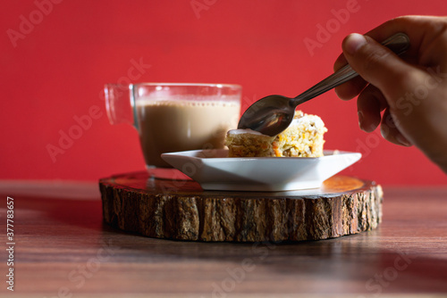 Carrot cake on wooden at home with chocolate cup