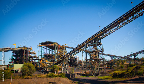 Coal wash plant, conveyors move coal around coal processing plant to wash coal in Queensland Bowen Basin. Fossil fuel industry, Environmental challenge, Climate Change. Logos removed. photo