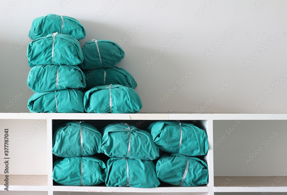 wrap of green fabric cloth used for surgery in shelf sterile