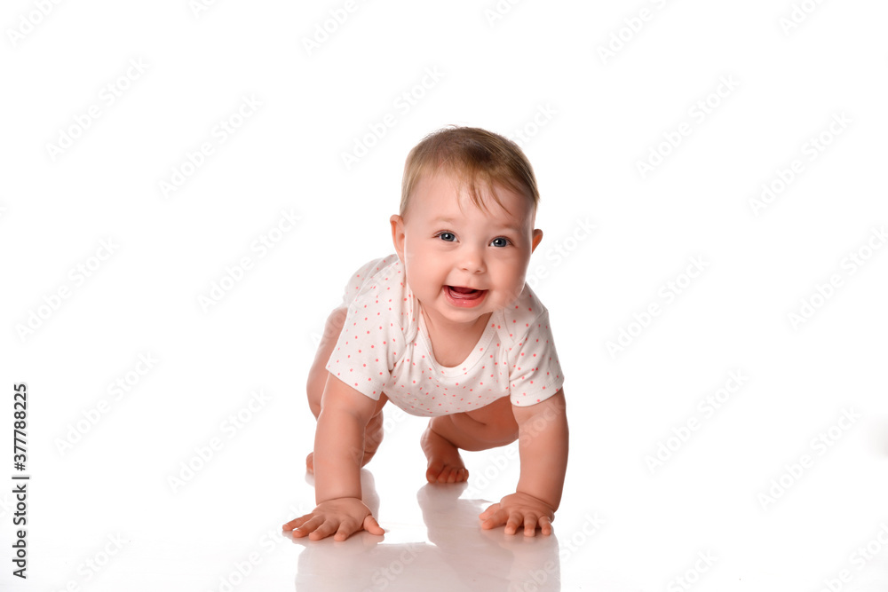 Cute little girl wearing a summer white bodysuit on a white background. Cute little girl wearing a summer white bodysuit on a white background.