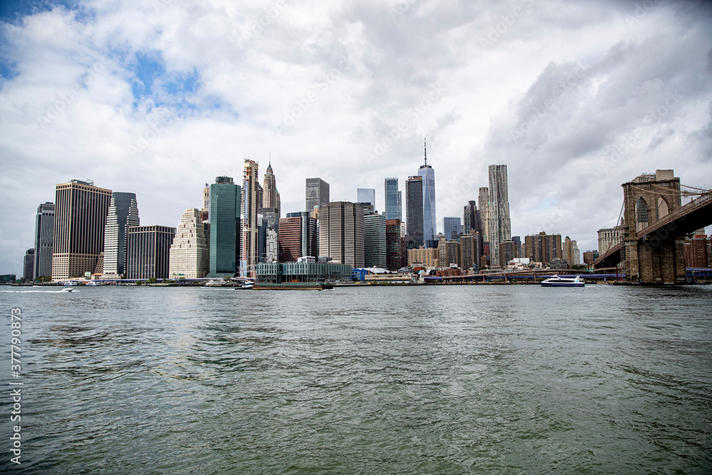 Naklejka premium A view of lower Manhattan skyline from the East River in New York City on Sunday, Sept. 13, 2020. (Gordon Donovan)
