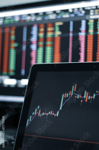 Stock exchange market trading at home. Work at home. Financial and economic concept. Stock market graph on laptop.