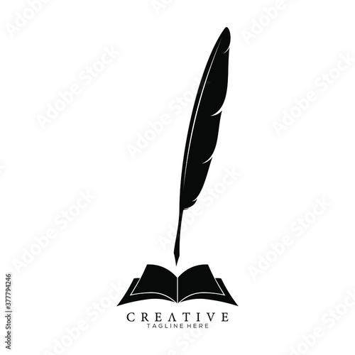 Black Feather Pen above an Open Book