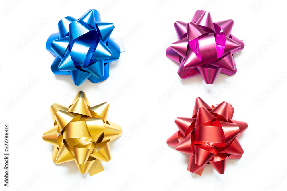 Ribbon bow banner in set of blue, violet, gold and red color on white paper background Ribbon bow banner in set of blue, violet, gold and red color on white paper background