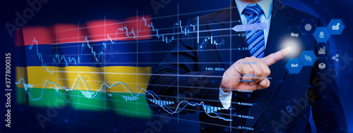 Businessman touching data analytics process system with KPI financial charts, dashboard of stock and marketing on virtual interface. With Mauritius flag in background. © TexBr