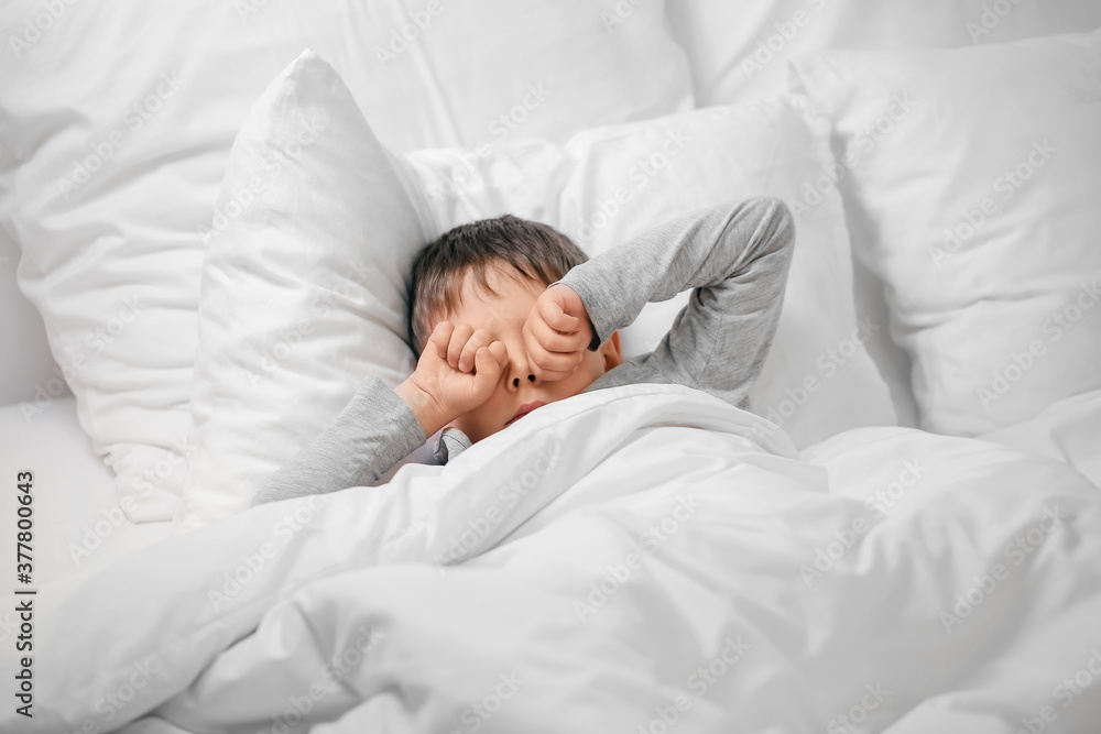 Little boy suffering from sleep disorder in bedroom Little boy suffering from sleep disorder in bedroom