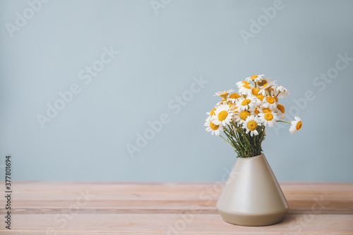 Wallpaper Mural Bouquet of fresh chamomile flowers in vase on table against grey background Torontodigital.ca