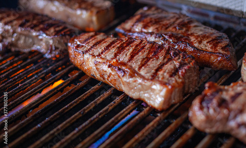 New York Strip Cut Beef - Barbeque Meat on a Grill, ready to Eat, with Copy Space