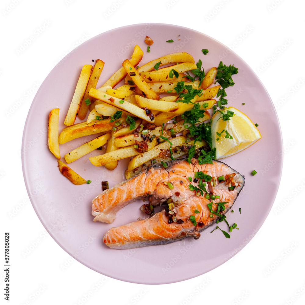 Delicious grilled salmon fillet with garnish of baked potatoes. Isolated over white background