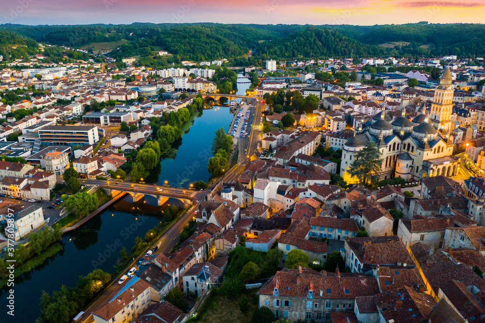 Flight over the evening city of Perigueux at sunset. France