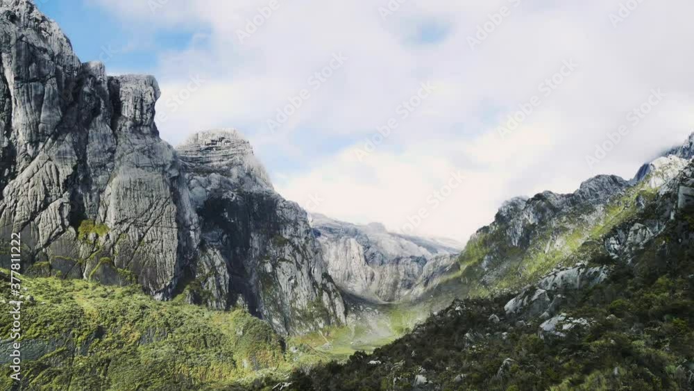 Time lapse of Mount Carstensz (Jayawijaya) wonderful landscape and scenery in West Papua, Indonesia HD Stock Footage Time lapse of Mount Carstensz (Jayawijaya) wonderful landscape and scenery in West Papua, Indonesia HD Stock Footage
