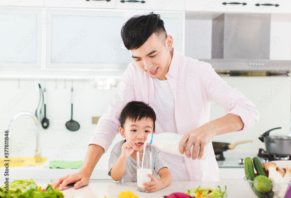 happy Family drinking milk at kitchen happy Family drinking milk at kitchen