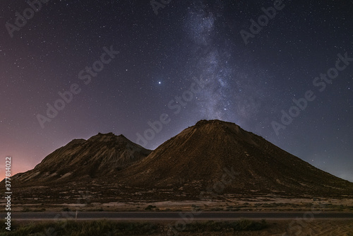 Starry sky with Milky Way galaxy over mountains