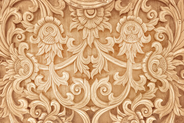 Pattern of flower carved on wood background