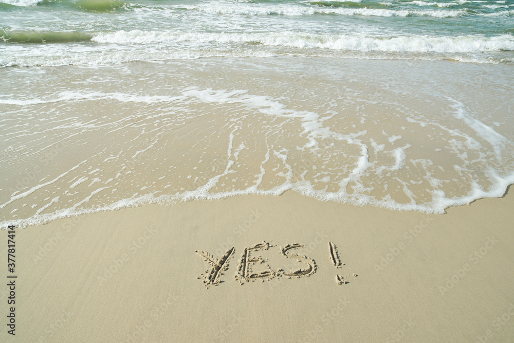 Fototapeta premium YES concept, word written on sand beach