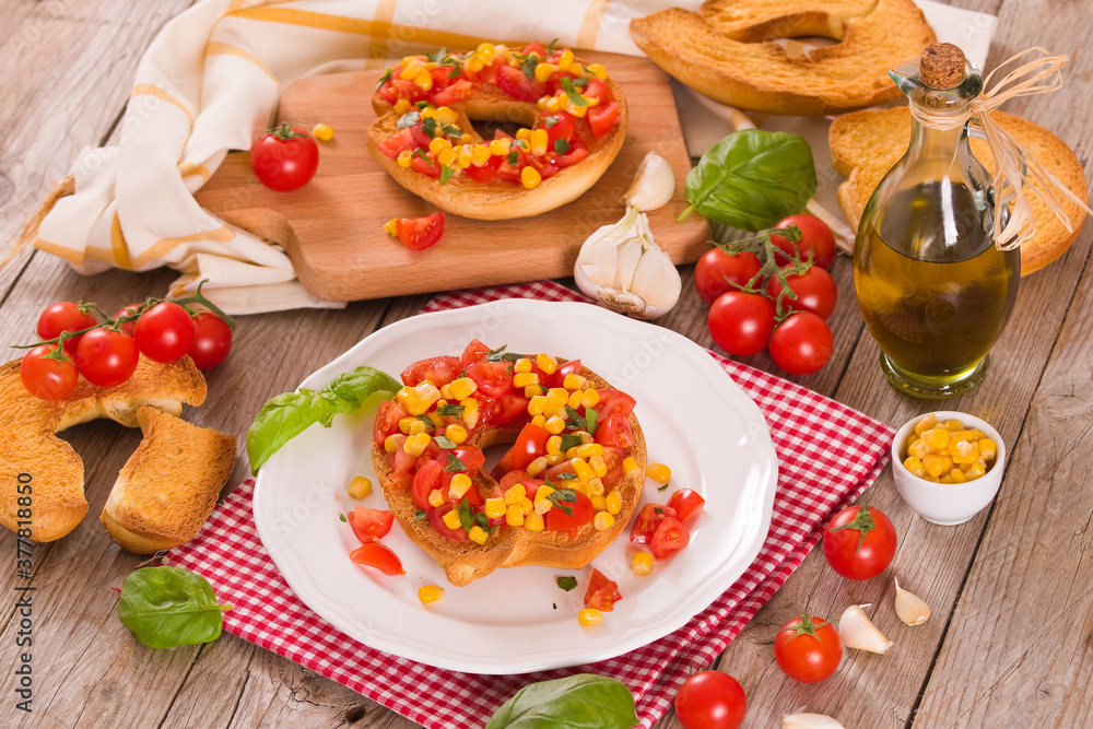 Friselle with tomatoes and mais. Friselle with tomatoes and mais.