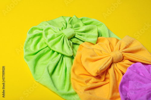 Delicate three bright turbans for women, girls or baby. Turban fashion or bandana hair accessories for the beach and travel.