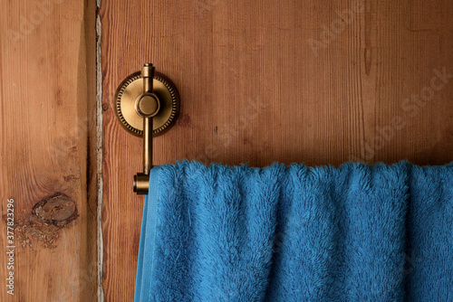 Part of furphy towel on vintage wooden bath door. photo