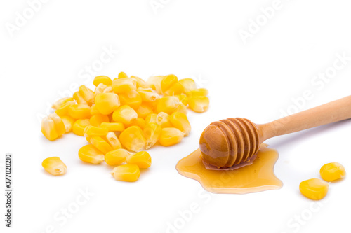 Delicious sweet yellow ripe corn kernels with honey On a white background