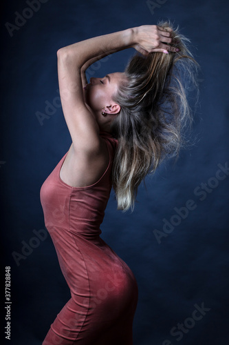 portrait of a young woman, shooting in a photo studio © vadim_fl