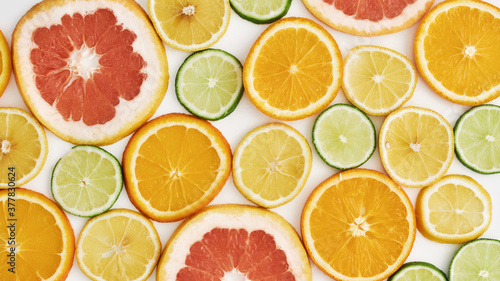 Top view of citrus fruits, Orange, tangerine, lemon, lime and grapefruit slices or circles isolated over white background