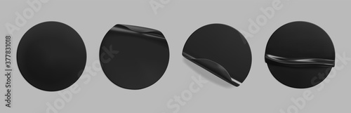 Black glued round crumpled sticker mockup set. Adhesive clear black paper or plastic stickers label with glued, wrinkled effect on grey background. Templates label or price tags. 3d realistic vector