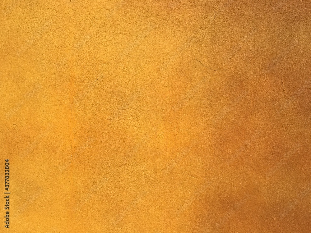 Fototapeta premium Vintage yellow cement background 