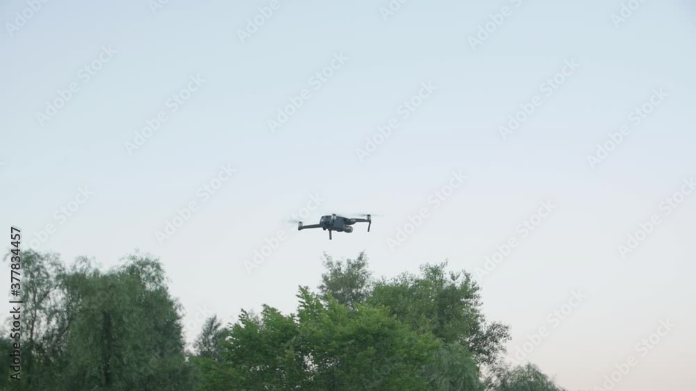 Drone hover in the sky slow motion professional quadcopter UAV camera movement Drone hover in the sky slow motion professional quadcopter UAV camera movement