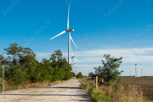 Wind turbines , wind farm in Botievo, Ukraine. Green sustainable energy. photo