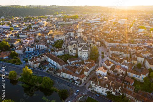 Drone view of French city of Perigueux on Isle River overlooking Romanesque building of ancient cathedral during summer sunset..
