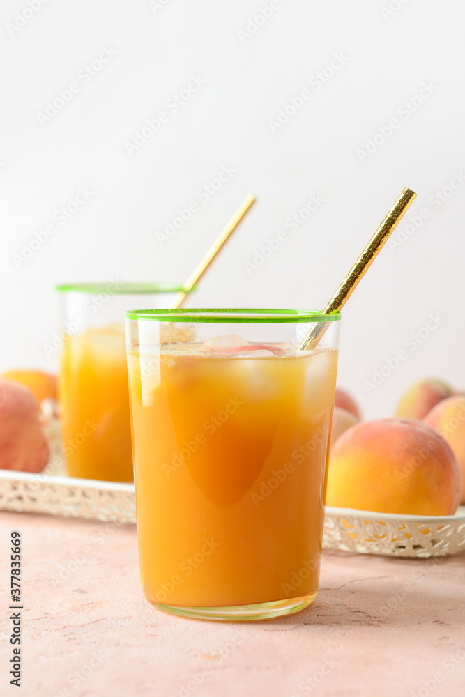 Glasses of fresh peach juice on table Glasses of fresh peach juice on table