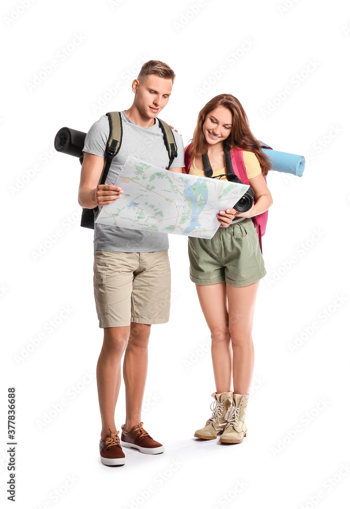 Obraz premium Couple of tourists with map on white background