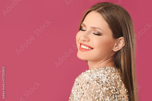 Canvas Print Young woman with beautiful eyeshadows on color background