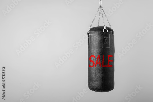punching bag hanging on colorful background with blank space on the  black friday © vovan