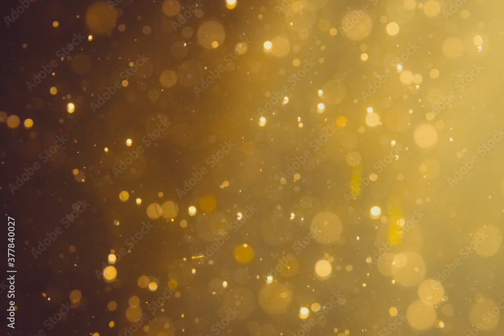 Dark Abstract Gold bokeh sparkle on black Dark Abstract Gold bokeh sparkle on black