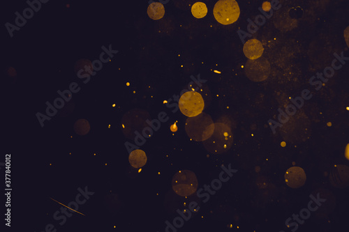 Dark Abstract Gold bokeh sparkle on black © pandaclub23