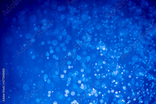Abstract dark blue christmas glitter lights defocused bokeh