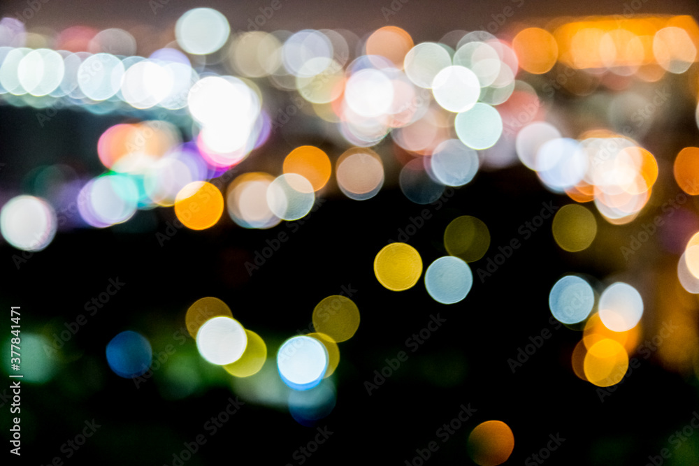 Fototapeta premium Blur defocus bokeh of light in the city with dark